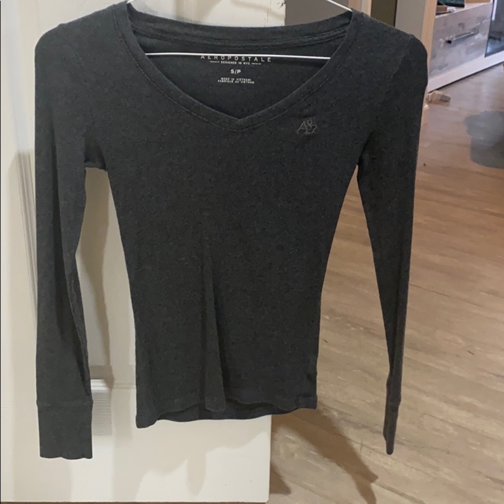 A long sleeved grey v neck
